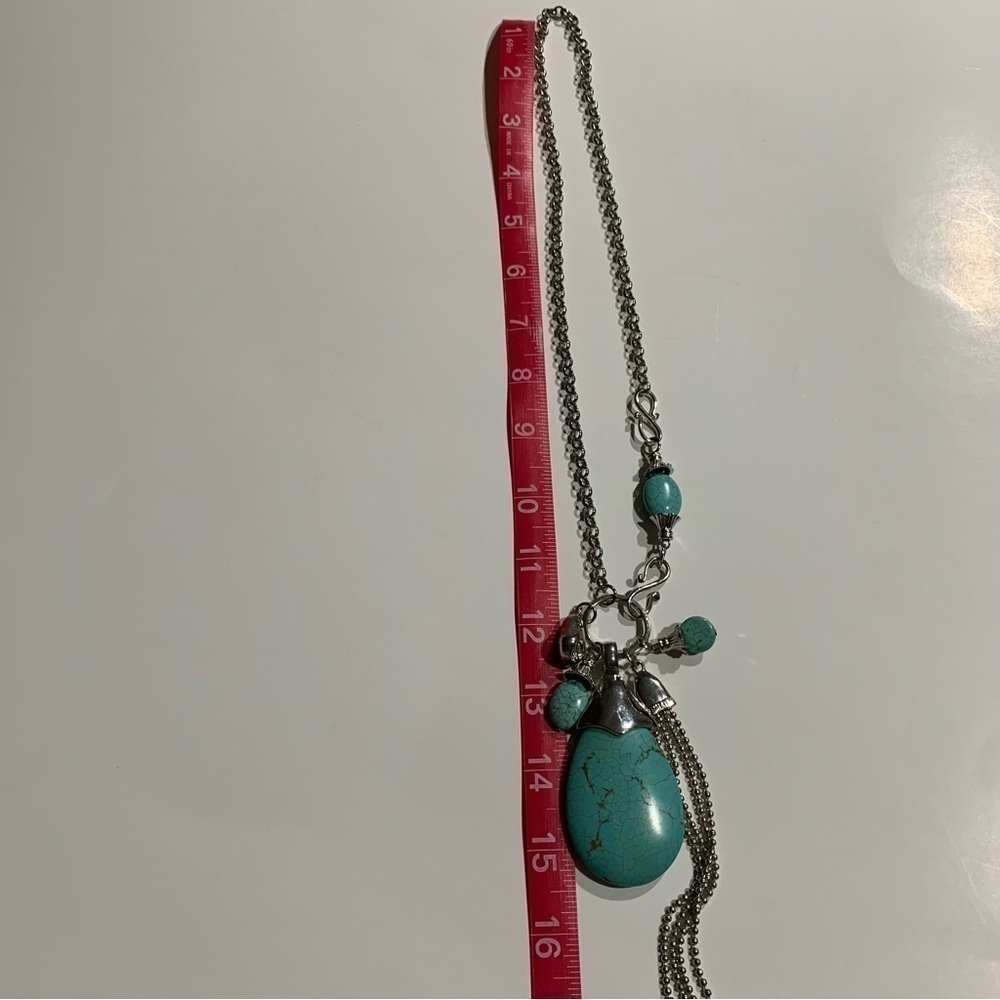 Silver tone and turquoise necklace with oversized pendant and charms. - Picture 6 of 8